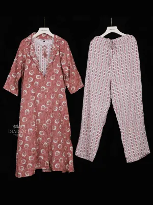 Dark Peach Crepe Straight Cut Suit Adorned with Floral Prints